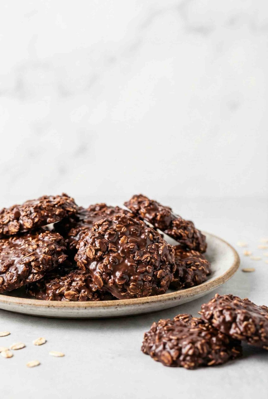 Macro photo of Chocolate No-Bake Cookies (Old Fashioned) on a ceramic plate with rich chocolate texture